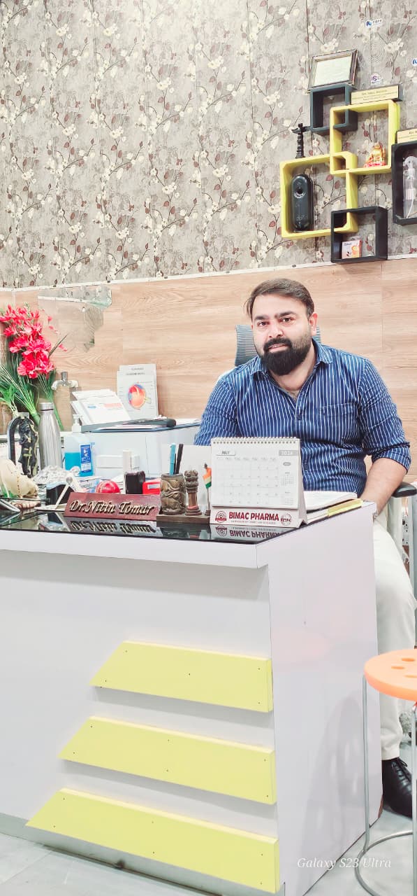 Dr. Nitin Tomer